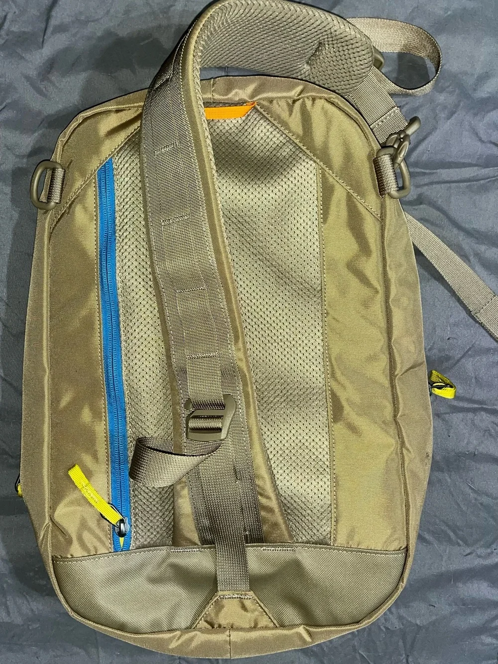 cotopaxi Tan Backpack with Blue Zipper and Multicolor Pulls